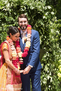 Indian bride and groom with garlands capture. Indian bride and groom with garlands capture.