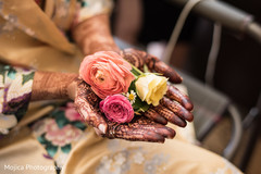 Lovely flowers held by maharanis hands with amazing mehndi art. Lovely flowers held by maharanis hands with amazing mehndi art.