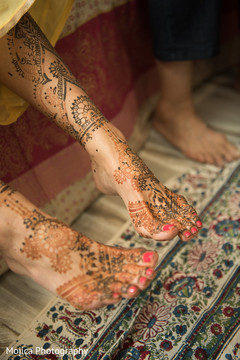 Indian bride showing mehndi art Indian bride showing mehndi art