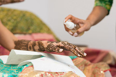 Indian bride getting her mehndi art done. Indian bride getting her mehndi art done.