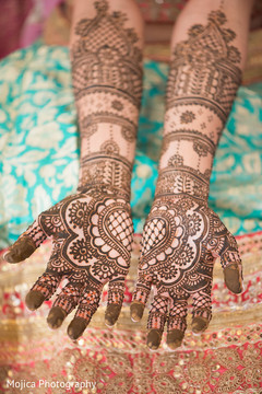Indian bride's hands with mehndi art capture. Indian bride's hands with mehndi art capture.