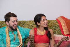 Joyful India couple at their pre-wedding mehndi celebration. Joyful India couple at their pre-wedding mehndi celebration.