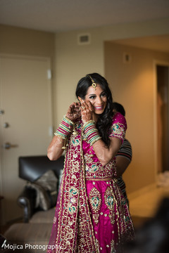 Maharani putting her earrings on for wedding reception. Maharani putting her earrings on for wedding reception.