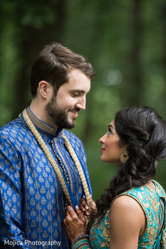 Romantic Indian bride and groom looking at each other. Romantic Indian bride and groom looking at each other.