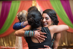 Joyful couple at their pre-wedding sangeet celebration. Joyful couple at their pre-wedding sangeet celebration.