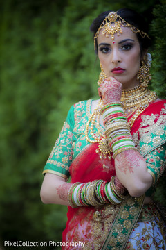Indian bride glowing in her wedding attire. Indian bride glowing in her wedding attire.