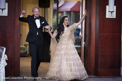 Lovely indian bride and groom making their entrance to reception Lovely indian bride and groom making their entrance to reception