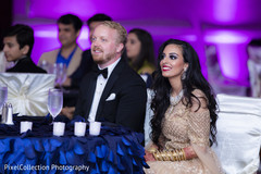 Lovely indian couple enjoying their wedding reception. Lovely indian couple enjoying their wedding reception.