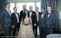 Indian lovebirds posing with groomsmen Indian lovebirds posing with groomsmen