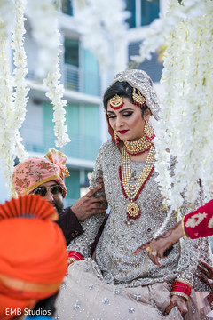 Maharani being help to enter the wedding ceremony mandap. Maharani being help to enter the wedding ceremony mandap.