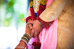 Indian lovebirds hands holding close up Indian lovebirds hands holding close up