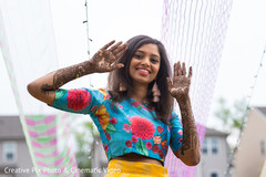 Indian bride showing mehndi art Indian bride showing mehndi art