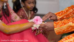 Indian wedding ritual of painting the bride with yellow turmeric paste Indian wedding ritual of painting the bride with yellow turmeric paste