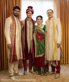 Elegant indian groom posing with family Elegant indian groom posing with family