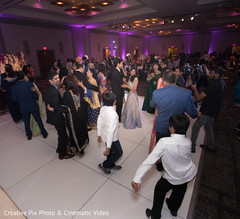 Indian lovebirds dancing with guests Indian lovebirds dancing with guests