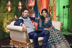Bride and Groom at their sangeet pre-wedding celebration. Bride and Groom at their sangeet pre-wedding celebration.