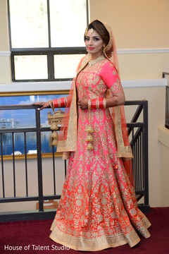 Indian bride posing with their ceremony Anarkali. Indian bride posing with their ceremony Anarkali.