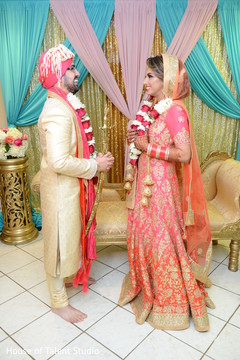 Indian bride and groom with garlands Indian bride and groom with garlands
