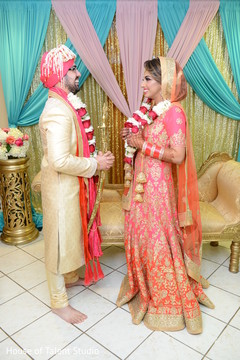 Indian bride and groom with garlands Indian bride and groom with garlands