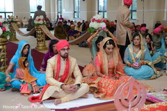 Lovely Indian couple getting blessed at the wedding ceremony. Lovely Indian couple getting blessed at the wedding ceremony.