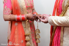 Sweet Indian couple exchanging rings. Sweet Indian couple exchanging rings.