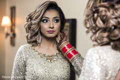 Indian bride with her wedding reception makeup done. Indian bride with her wedding reception makeup done.