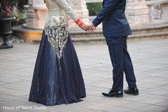Dazzling Indian bride and groom holding hands. Dazzling Indian bride and groom holding hands.