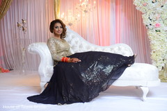 Glamorous Indian bride at her wedding reception. Glamorous Indian bride at her wedding reception.