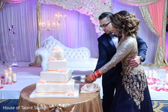 Marvelous Indian wedding cake cutting moment. Marvelous Indian wedding cake cutting moment.