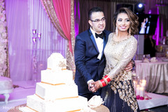 Incredible Indian wedding cake cutting moment. Incredible Indian wedding cake cutting moment.
