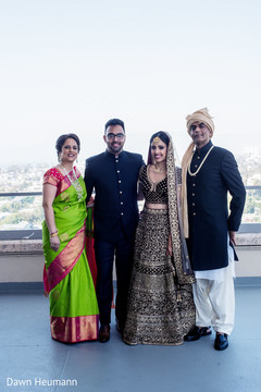 Adorable Indian bride posing with family. Adorable Indian bride posing with family.