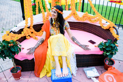 Indian bride getting mehndi art done Indian bride getting mehndi art done