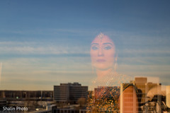Marvelous Indian bride's reflecting on the window glass. Marvelous Indian bride's reflecting on the window glass.
