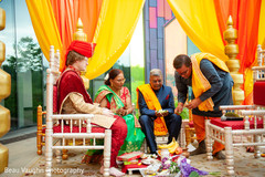 Indian groom on a pre-ceremony ritual with parents. Indian groom on a pre-ceremony ritual with parents.
