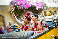 Indian lovebirds inside wedding car Indian lovebirds inside wedding car