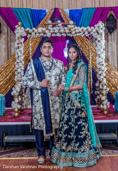 Lovely indian couple in their sangeet outfits Lovely indian couple in their sangeet outfits