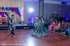 Indian bride and groom dancing during sangeet Indian bride and groom dancing during sangeet