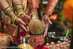 Indian bride's parents holding ceremonial coconut. Indian bride's parents holding ceremonial coconut.