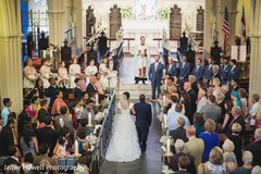 Marvelous moment of Indian bride entering the Christian wedding ceremony.