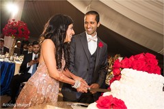Lovely capture Indian bride and groom cutting cake together. Lovely capture Indian bride and groom cutting cake together.