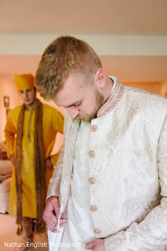Indian groom getting ready scene Indian groom getting ready scene