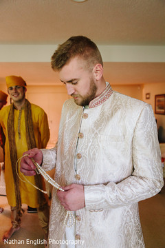 Charming indian groom getting ready moment Charming indian groom getting ready moment