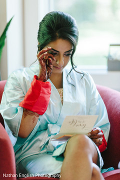 Emotional moment of indian bride reading groom's card Emotional moment of indian bride reading groom's card
