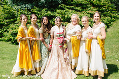 Glamorous indian bride posing with bridesmaids Glamorous indian bride posing with bridesmaids