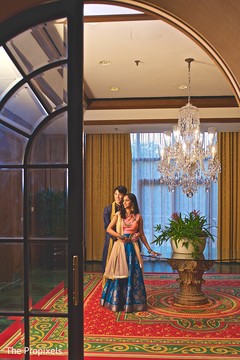 Elegant couple taking pictures prior to the sangeet Elegant couple taking pictures prior to the sangeet