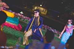 The elegant groom dances during the sangeet. The elegant groom dances during the sangeet.