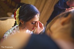 The Indian bride wears the tikka. The Indian bride wears the tikka.