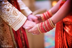 The soon to be Indian newlyweds hold hands. The soon to be Indian newlyweds hold hands.