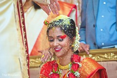 Smiles as the Indian wedding rituals happen. Smiles as the Indian wedding rituals happen.
