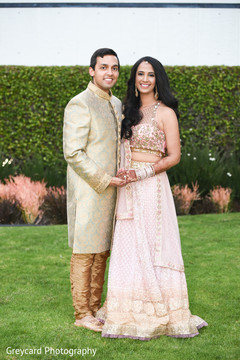 Enchanting indian couple with their sangeet outfits. Enchanting indian couple with their sangeet outfits.
